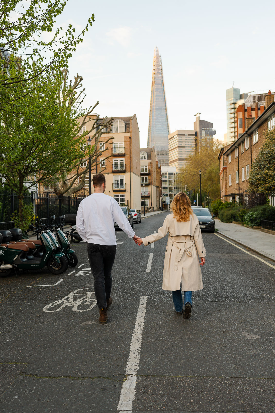 couple walking through london towards the shard