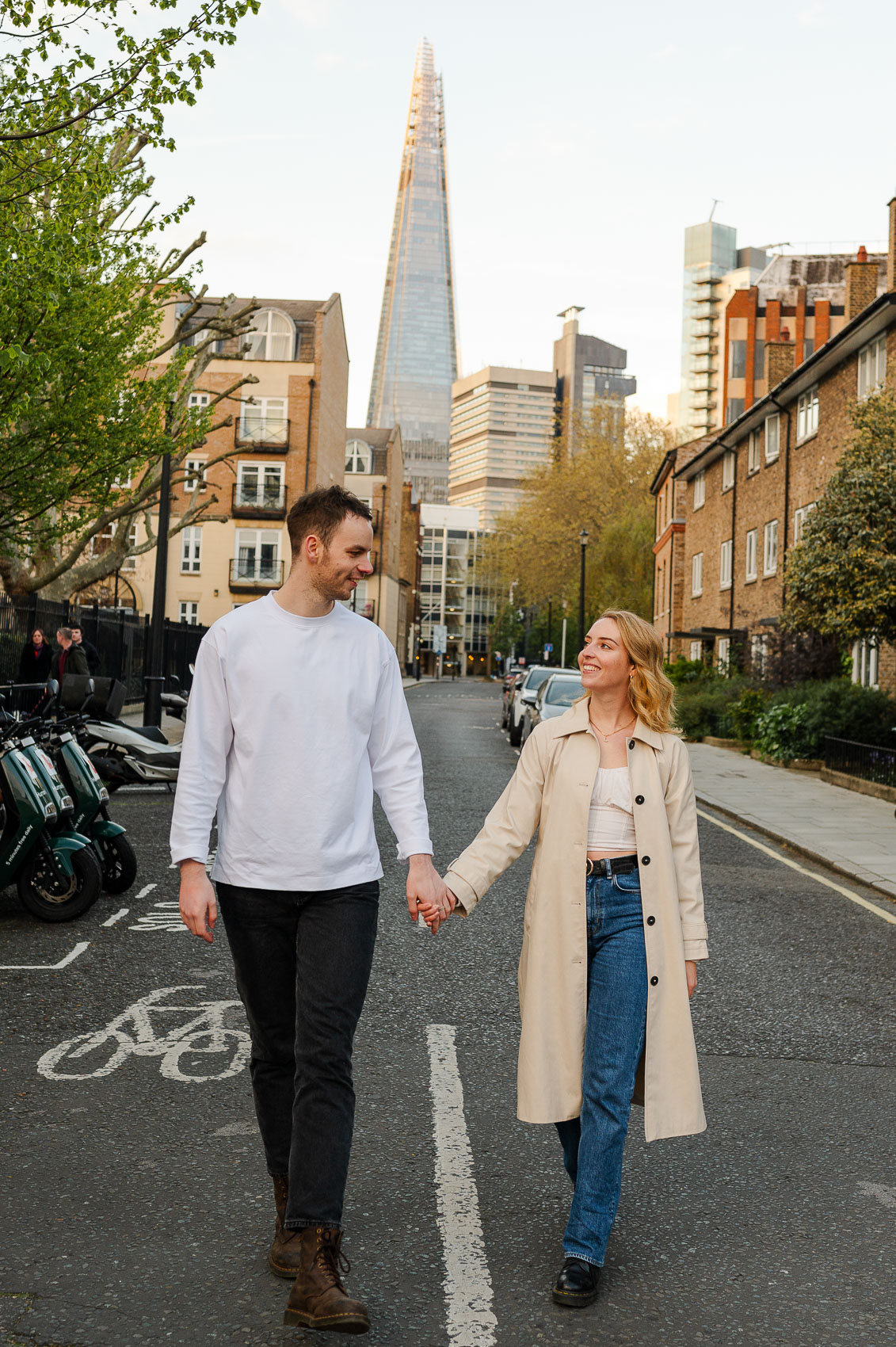 couple walks away from the iconic london shard