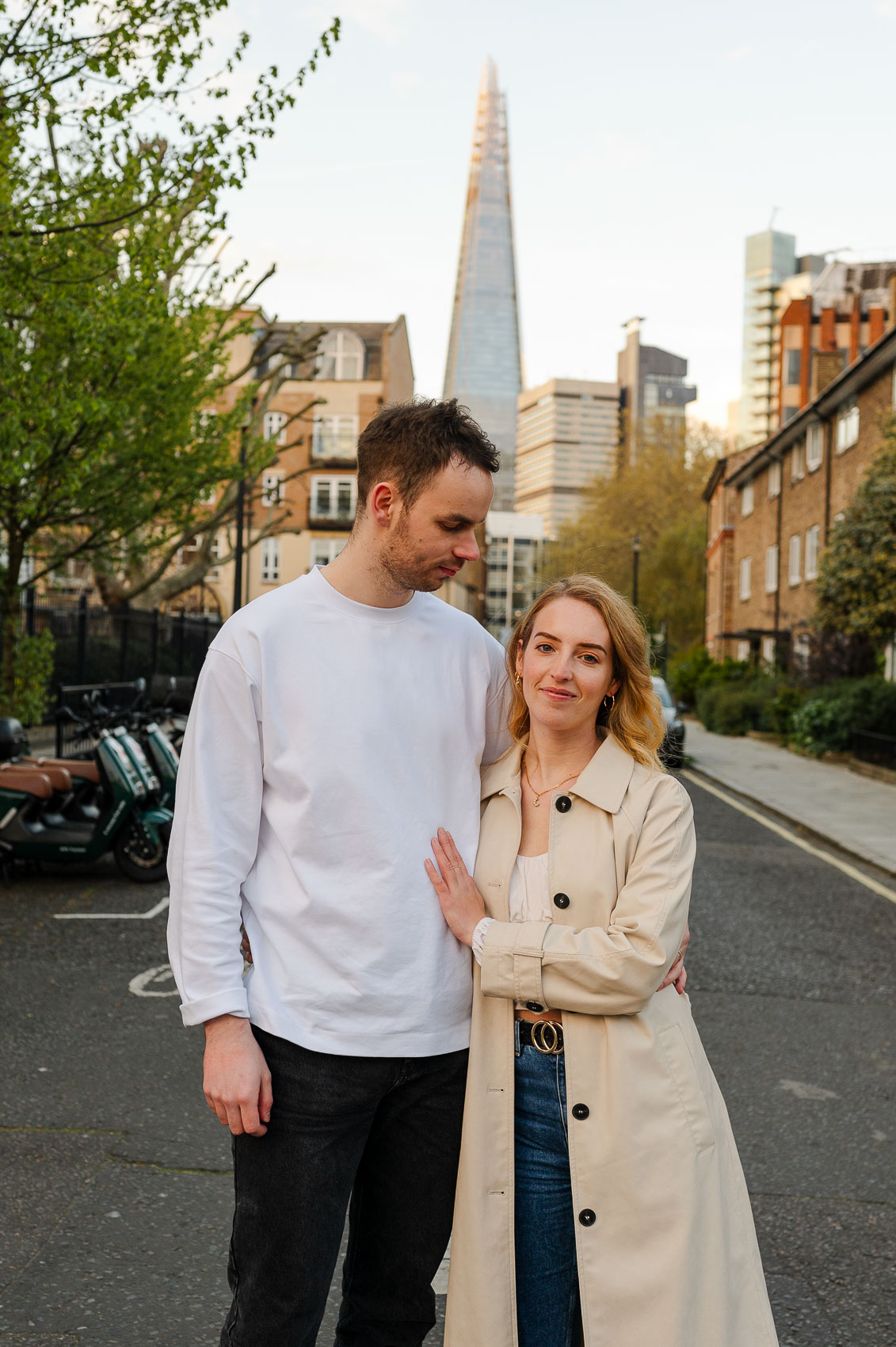 young couple hugs during sunset in london